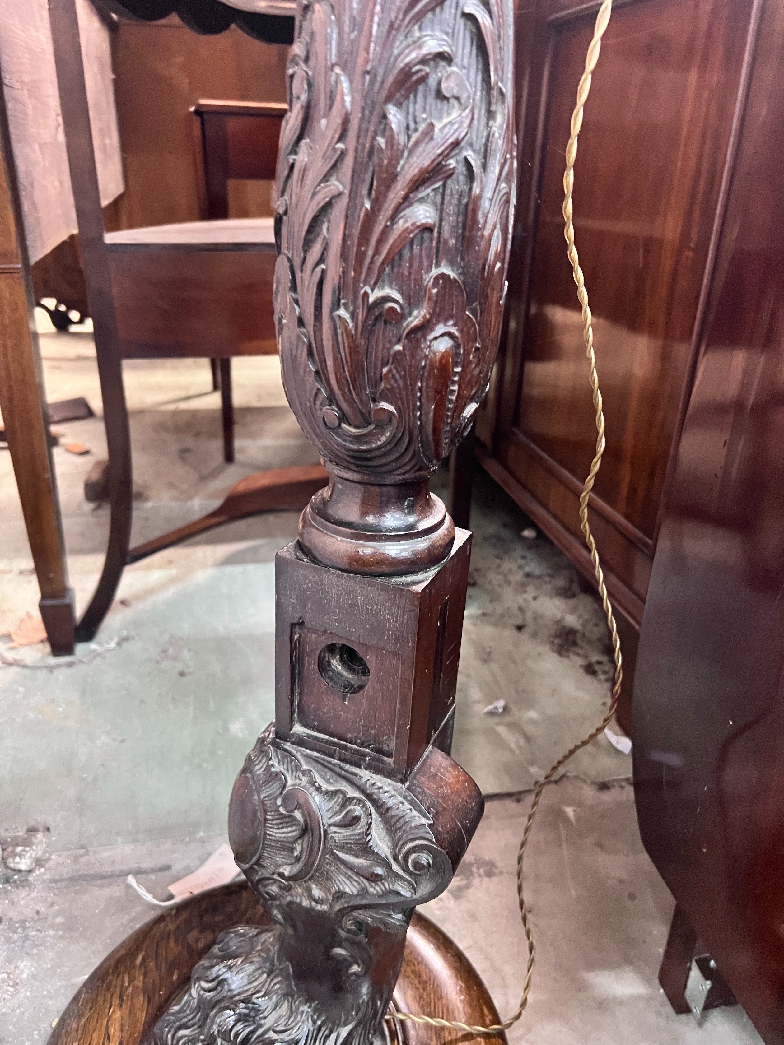 A carved oak and mahogany carved standard lamp, height 151cm *Please note the sale commences at 9am.